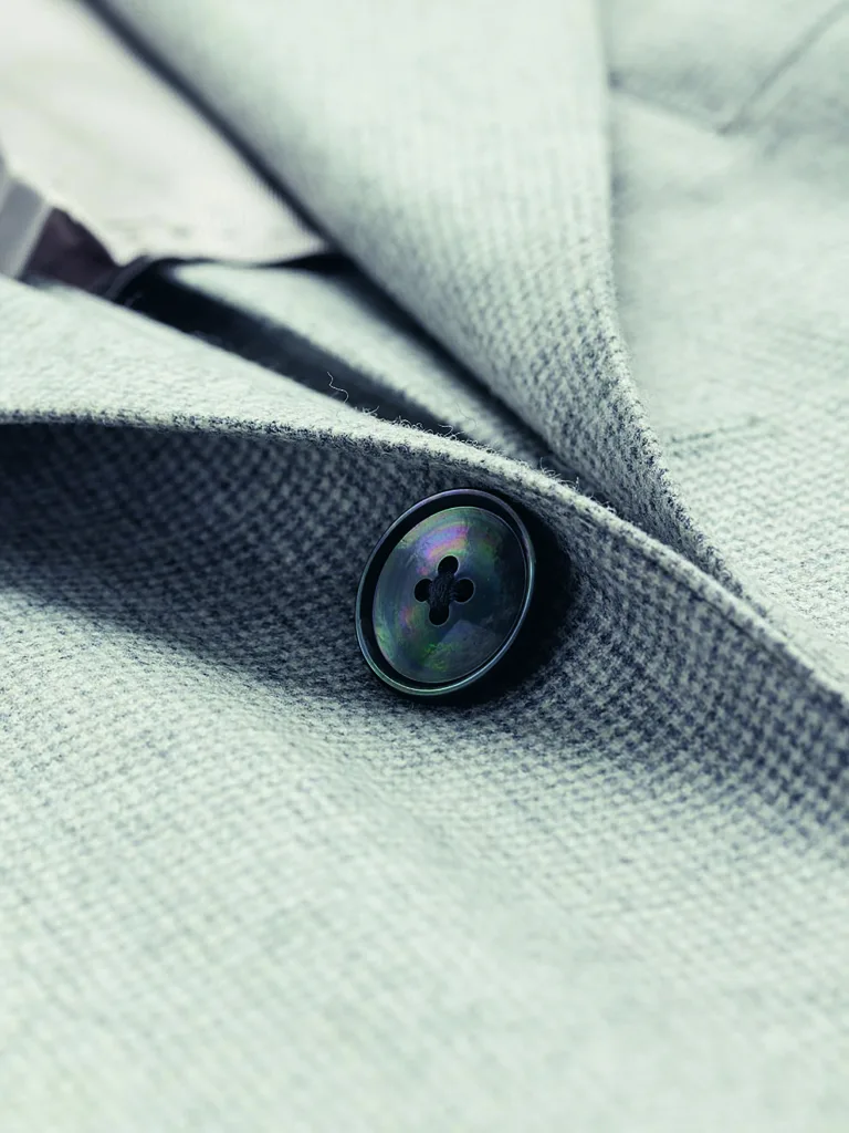 A suit button in a closeup-view